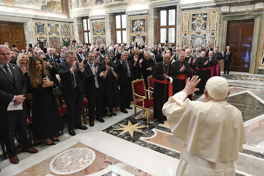 Pope Francis greets members of The Papal Foundation and their families during a meeting at the Vatican April 12, 2024. (CNS photo/Vatican Media)