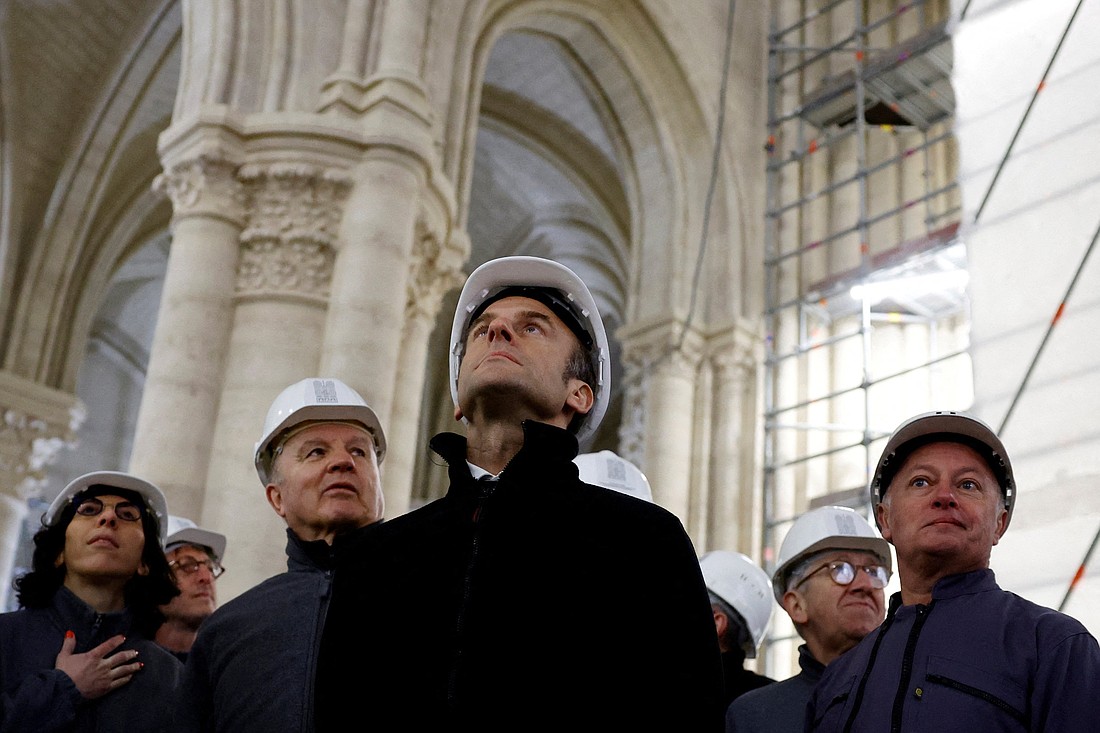 French President Emmanuel Macron, French Culture Minister Rima Abdul Malak, French Army Gen. Jean-Louis Georgelin and chief architect Philippe Villeneuve, wearing working helmets, visit the restoration site at the Notre Dame Cathedral in Paris April 14, 2023. The reconstruction work entered its last phase as the world prepared to observe the fifth anniversary of the April 15, 2019, blaze that caused the spire to collapse inside the cathedral. Notre Dame is scheduled to reopen Dec. 8, 2024. (OSV News photo/Sarah Meyssonnier, pool via Reuters)