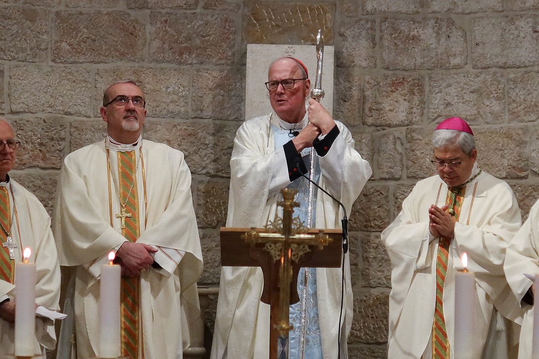 Cardinal Timothy M. Dolan of New York, center, holds his crozier during Mass at the Our Lady of Peace chapel in the Notre Dame of Jerusalem Center, a pontifical institute dedicated to ecumenical and interreligious dialogue, in Jerusalem April 13, 2024. The cardinal was reported safe amid Iran launching an unprecedented wave of missile and drone attacks on Israel later that evening. OSV News photo/Sinan Abu Mayzer, Reuters