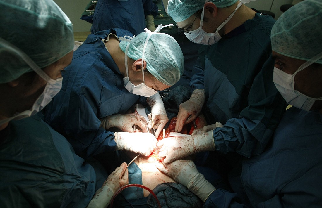 A file photo shows surgeons extracting the liver and kidneys of a brain-dead woman for organ donation and transplantation. The National Catholic Bioethics Center released an April 11, 2024, statement calling for consistent clinical, legal, and ethical standards regarding the declaration of brain death. (OSV News photo/Fabrizio Bensch, Reuters) EDITORS: NOTE GRAPHIC CONTENT.