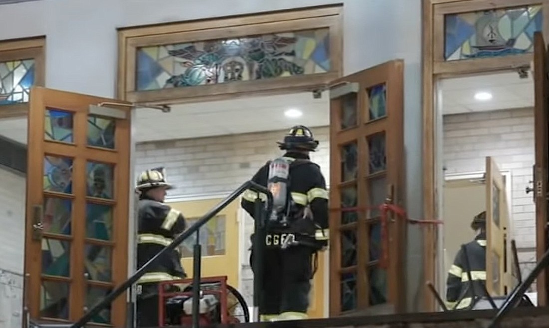 Firefighters enter Our Lady of the Lake Catholic Church n Verona, N.J., April 4, 2024, following a fire. The church, purposely set on fire, say police, was preparing to mark its 100th anniversary. The fire damaged the pews and charred statues of Mary and Joseph. (OSV News photo/YouTube)