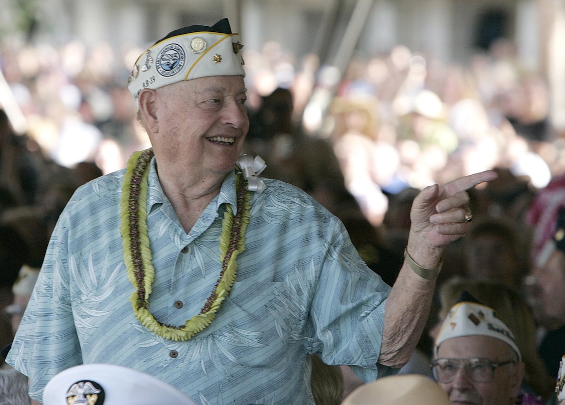 USS Arizona survivor Lou Conter gestures to a fellow survivor during the wreath laying presentation for the 70th anniversary of the attack on Pearl Harbor at the World War II Valor in the Pacific National Monument in Honolulu Dec. 6, 2011. Conter, 102, a Catholic member of the Knights of Columbus and the last survivor of the USS Arizona destroyed in the Japanese Dec. 7, 1941, attack on Pearl Harbor, passed away April 1, 2024. (OSV News photo/Hugh Gentry, Reuters)