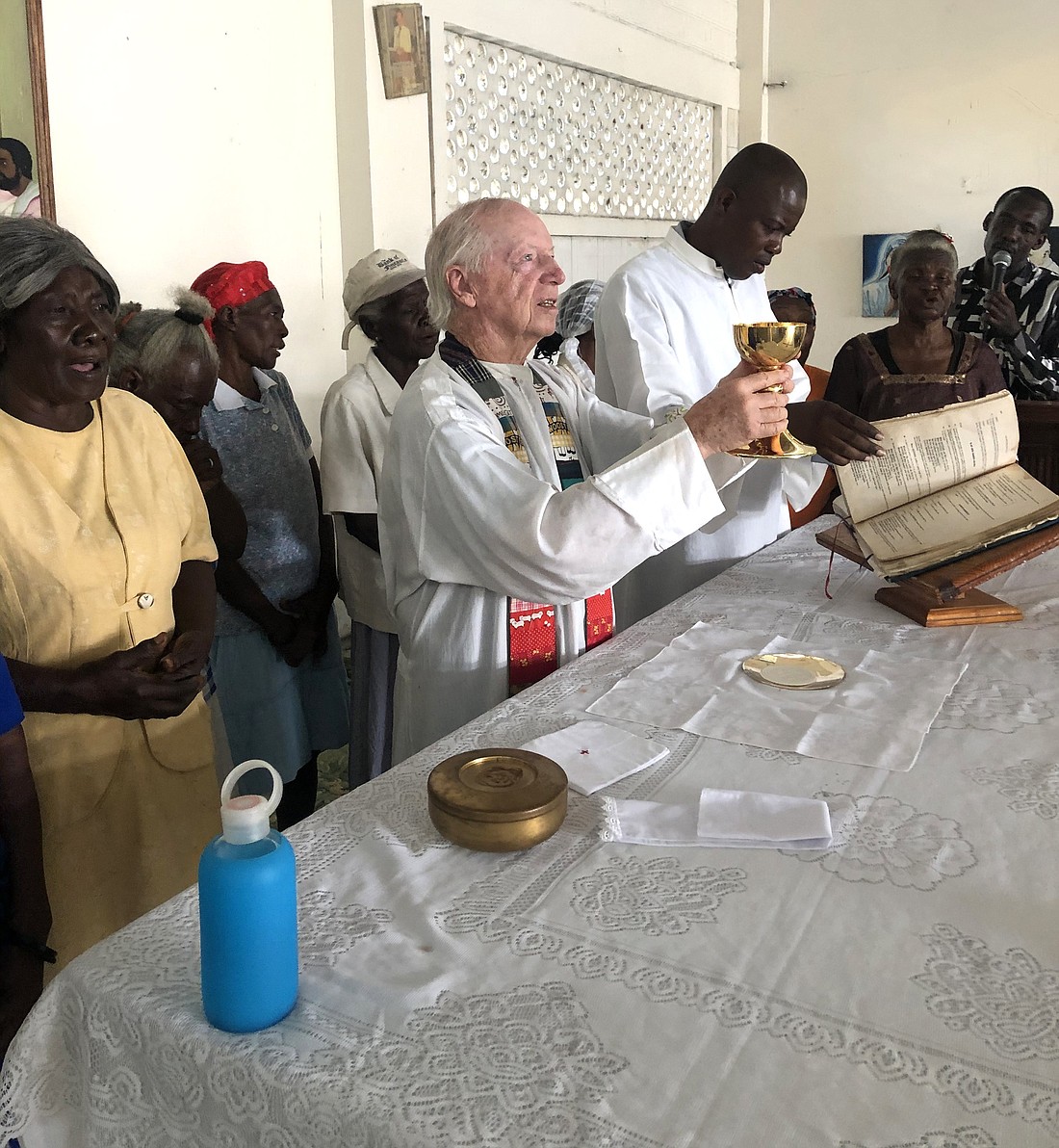 In this undated photo, Father Thomas Hagan, an Oblate of St. Francis de Sales, celebrates Mass in Cité Soleil, Haiti, which is served by the nonprofit ministry he founded called Hands Together. (OSV News photo/Hands Together)