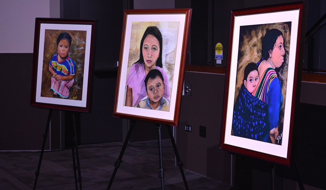 Copies of Sister Norma Pimentel's art depicting immigrants who sought shelter at her organization's humanitarian respite center are on display nationally for the first time at Holy Name Cathedral in Chicago April 15, 2024. Sister Pimentel, a Missionary of Jesus and head of Catholic Charities of the Rio Grande Valley in the Diocese of Brownsville, Texas, is known for aiding migrants at the Southern border. (OSV News photo/Simone Orendain)