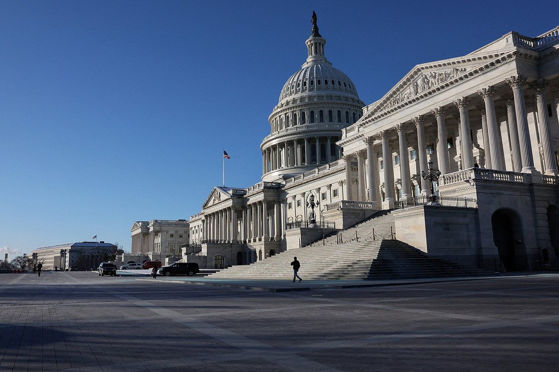 A person walks past the Senate side of the U.S. Capitol building in Washington, Jan. 17, 2024. (OSV News photo/Leah Millis, Reuters)