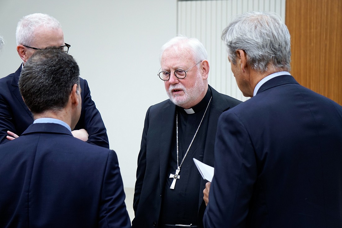 Archbishop Paul R. Gallagher, the Vatican foreign minister, speaks with people attending a conference on Vatican diplomacy during the pontificate of Pope Pius XII at the Pontifical Gregorian University in Rome April 18, 2024. CNS photo/Carol Glatz
