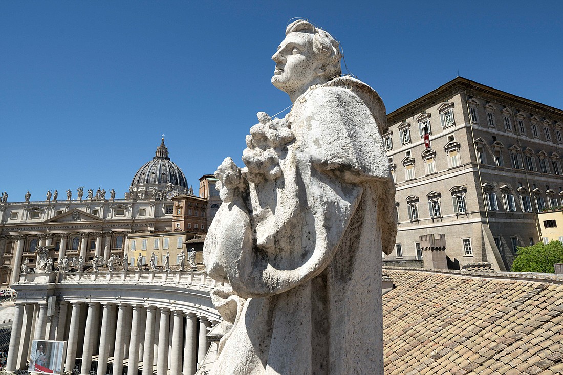 Pope Francis talks to visitors gathered in St. Peter's Square at the Vatican April 21, 2024, for his recitation of the "Regina Coeli" prayer. (CNS photo/Vatican Media)