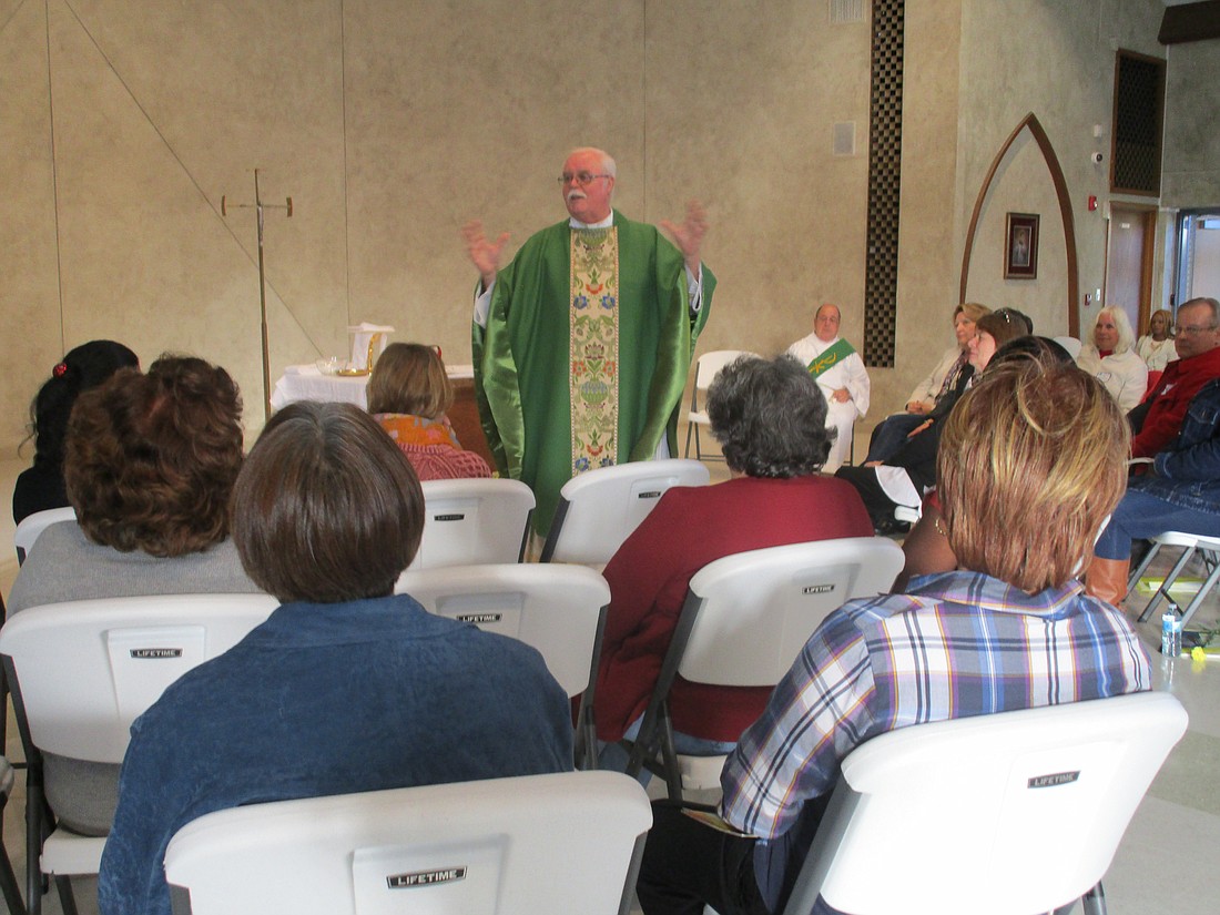 Vincentian Father Martin McGeough, C.M., celebrates Mass in St. Aloysius Parish, Jackson, in this 2016 file photo. Father McGeough, who served as coordinator of Jail and Prison Ministry for more than five years, died April 24. Lois Rogers photo