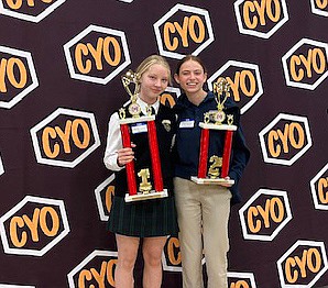 Shown are St. Paul School, Princeton, students, Stephanie Chynoweth, left and Amelia Kenney, participated in the varsity competition of the spelling bee. Chynoweth was the winner while Kenney was runner-up. Courtesy photo
