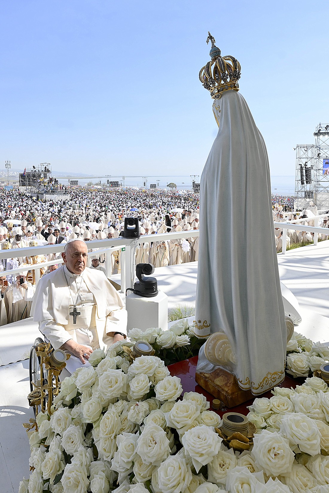 Pope Francis prays in front of a statue of Our Lady of Fátima before beginning his celebration of the closing Mass for World Youth Day at Tejo Park in Lisbon, Portugal, Aug. 6, 2023. (CNS photo/Vatican Media)