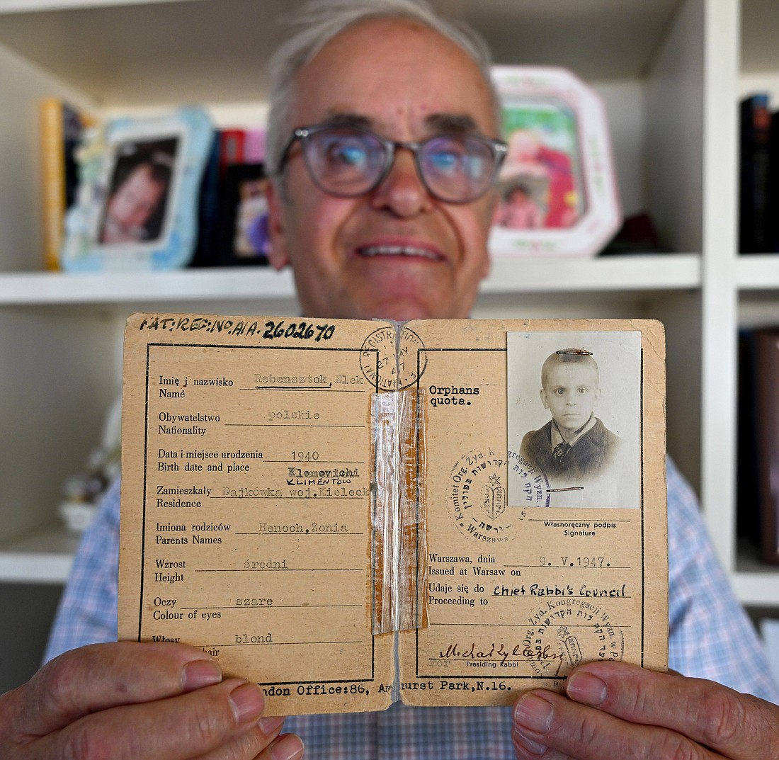 Holocaust survivor Alex Rosin, 83, born in Poland in 1940, holds his Polish identity certificate from the Vaad Hakehillos of Poland, in his home in Jerusalem, May 5, 2024. Rosin was saved by living with a Catholic woman in rural Poland. (OSV News photo/Debbie Hill)