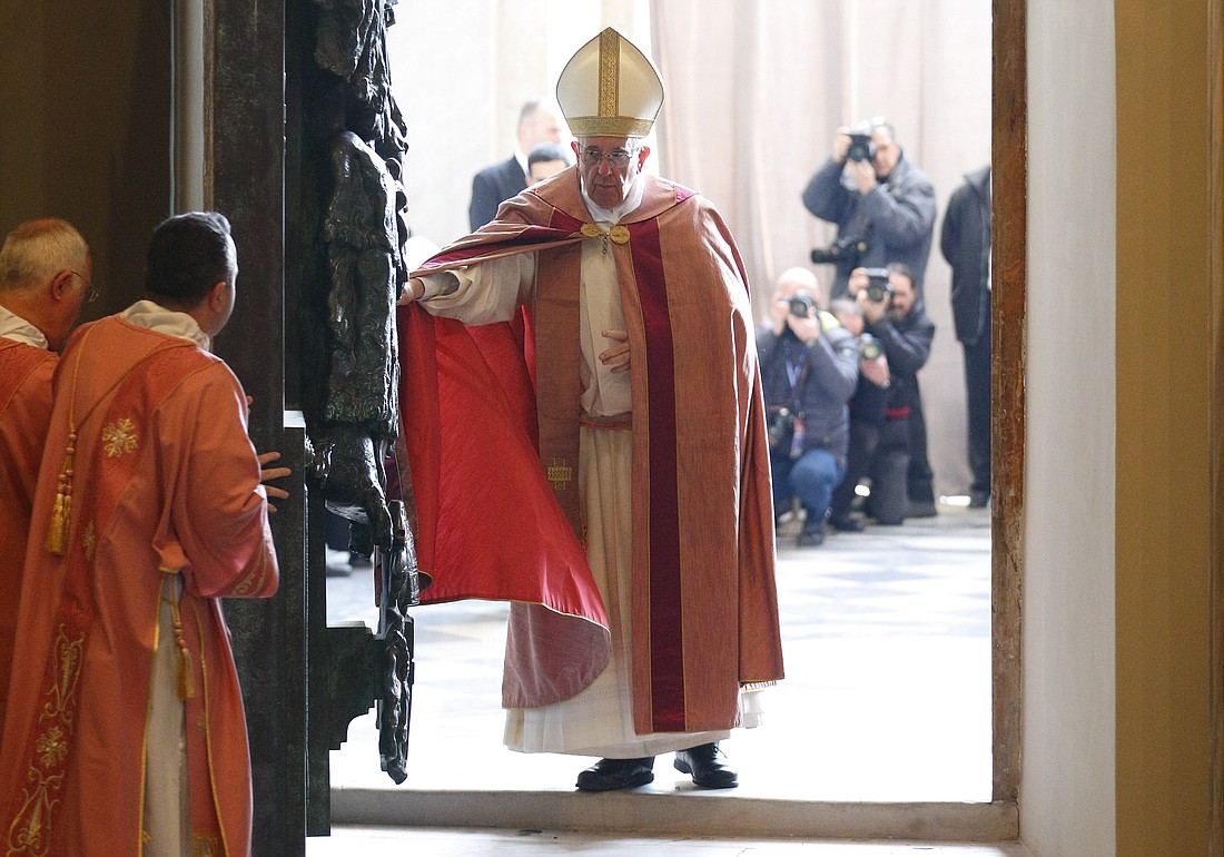 Pope Francis opens the Holy Door of the Basilica of St. John Lateran in Rome in this Dec. 13, 2015, file photo. The pope has approved the theme "Pilgrims of Hope" to be the motto for the Holy Year 2025. (CNS photo/Paul Haring)