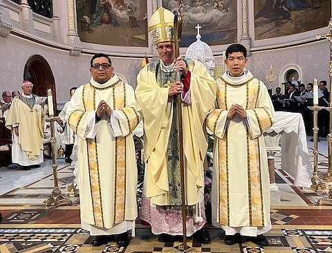 Following the Mass of Ordination, Bishop O'Connell poses for a photo with Rev. Mr. Juan Carlos Perez, C.M., and Rev. Mr. Paul Phuong Pham, C.M. Staff photo