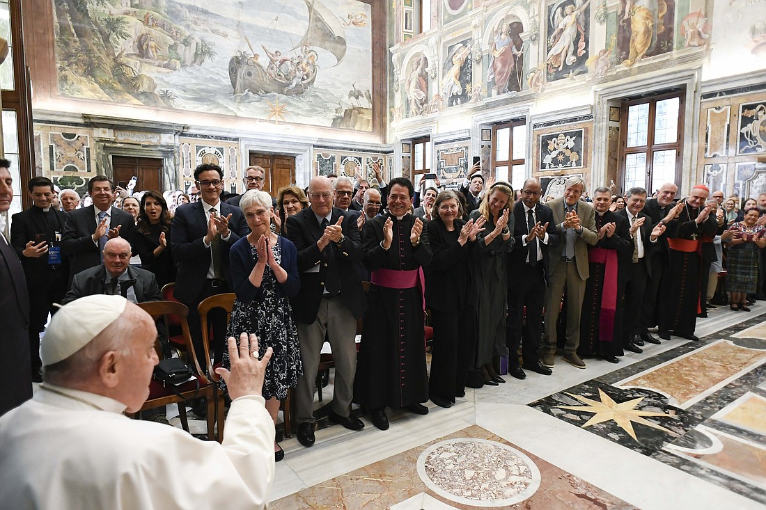 Pope Francis greets people taking part in a conference on human fraternity at the Vatican May 11, 2024. (CNS photo/Vatican Media)