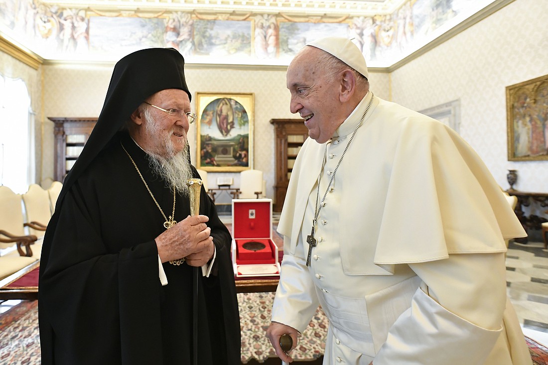 Pope Francis meets with Orthodox Ecumenical Patriarch Bartholomew of Constantinople in the library of the Apostolic Palace at the Vatican Sept. 30, 2023, ahead of an ecumenical prayer vigil for the Synod of Bishops in St. Peter's Square. (CNS photo/Vatican Media)