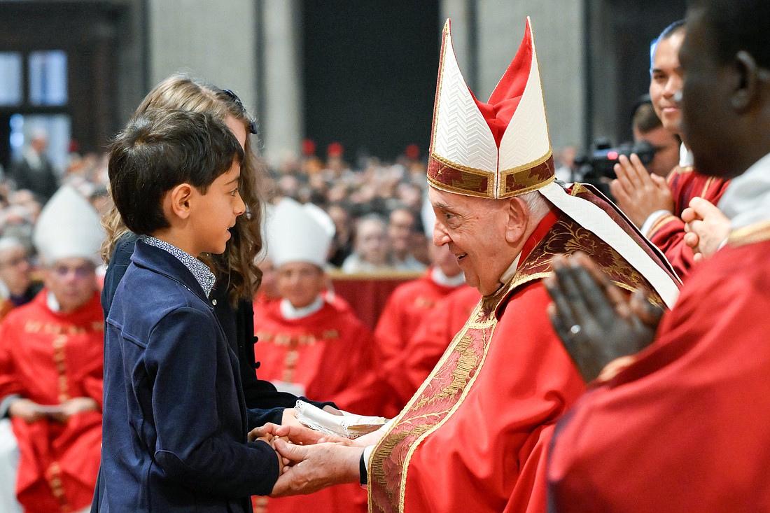 Pope Francis accepts the offertory gifts during Pentecost Mass in St. Peter's Basilica at the Vatican May 19, 2023. (CNS photo/Vatican Media)