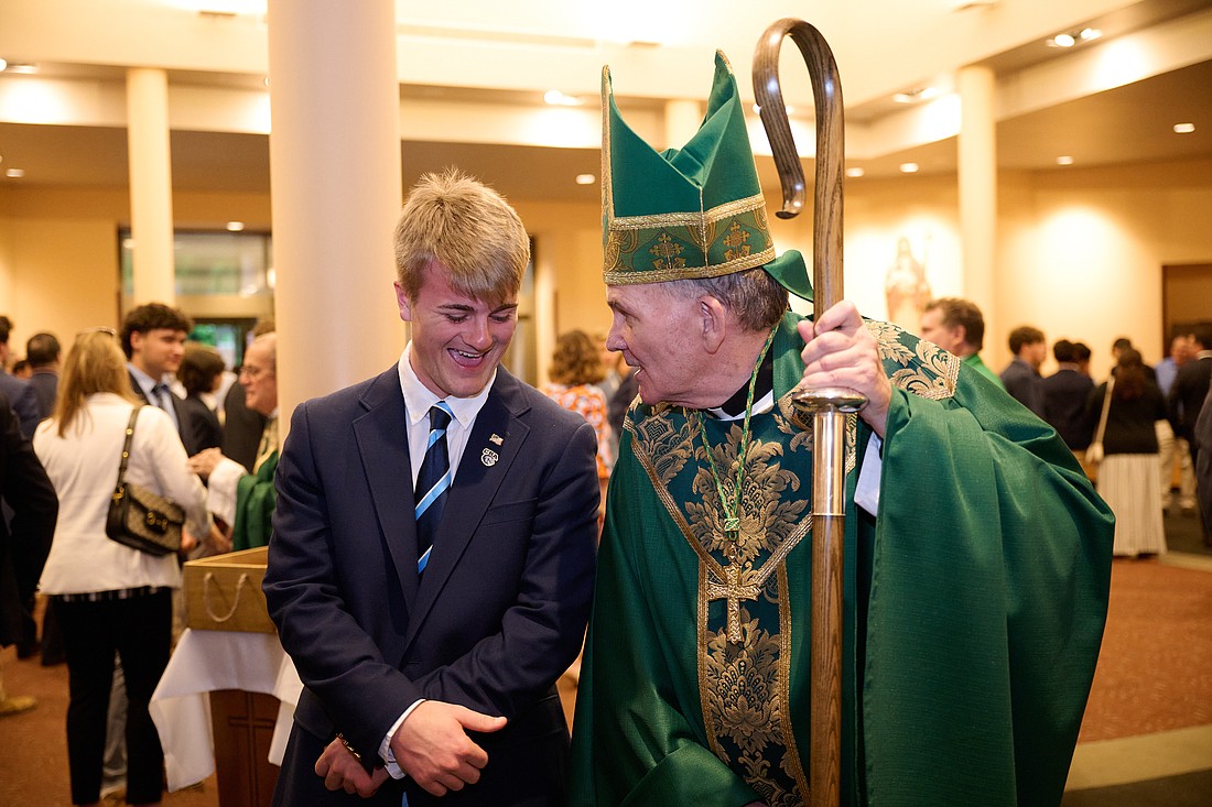 Bishop O'Connell greets CBA senior Matthew Wilhelm following the May 21 Baccalaureate Mass in St. Mary, Mother of God Church, Middletown. The Baccalaureate Mass marked the start of the 2024 graduation season in the Diocese of Trenton. Mike Ehrmann photo