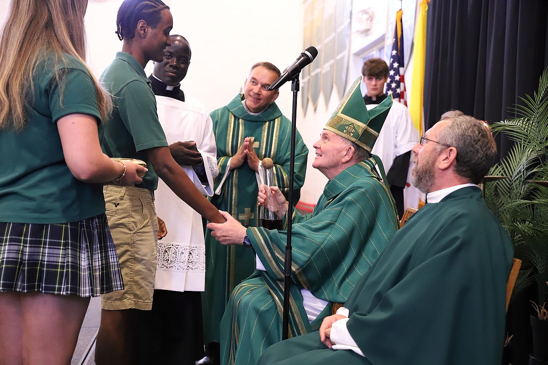 Bishop O'Connell accepts the gifts of bread and wine during the Mass he celebrated for Red Bank Catholic High School seniors. John Batkowski photo
