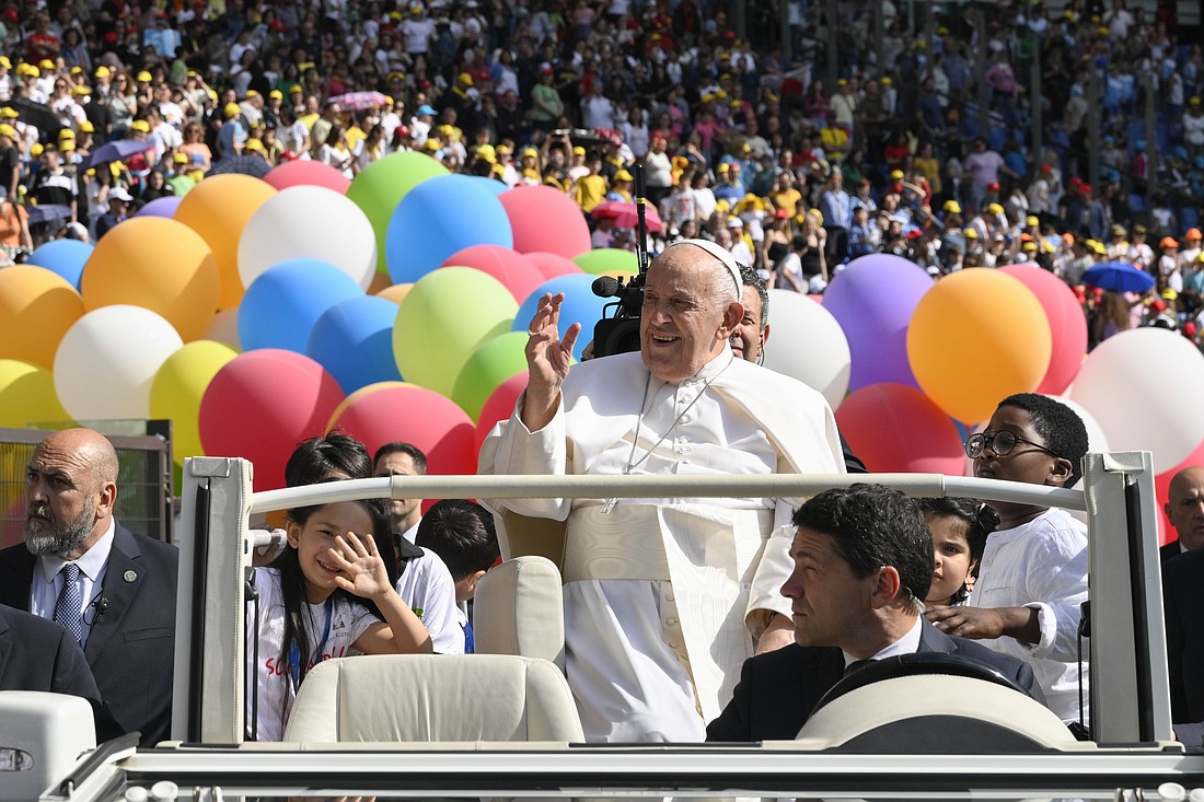 Pope Francis waves from the popemobile during the first World Day of Children May 25, 2024, in Rome's Olympic Stadium. (CNS photo/Vatican Media)