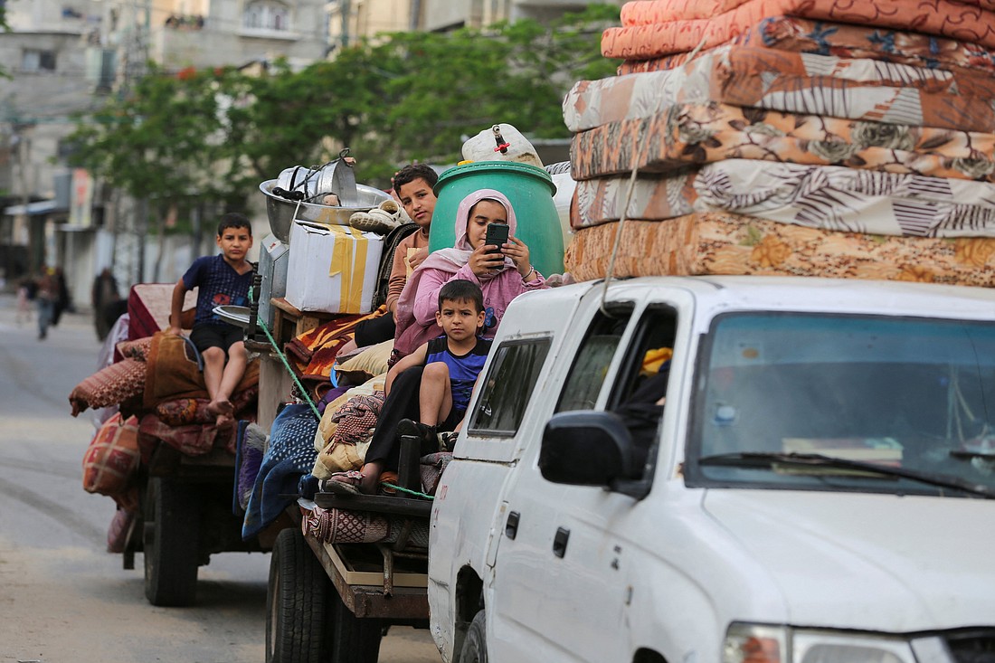 Palestinians travel in vehicles loaded with their belongings as they flee Rafah due to an Israeli military operation in Rafah, in the southern Gaza Strip, May 28, 2024. (OSV News photo/Hatem Khaled, Reuters)