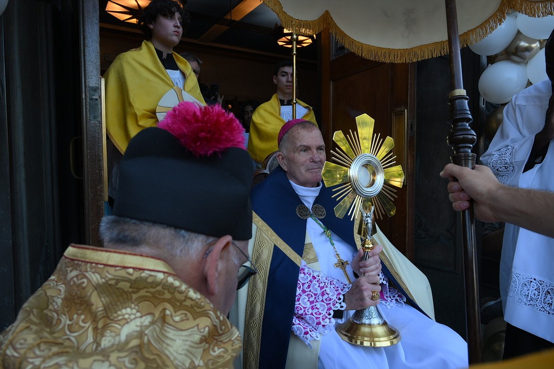 Bishop David M. O'Connell, C.M., holds the monstrance that is traveling on the Seton route to Indianapolis for the National Eucharistic Revival. Mike Ehrmann photo