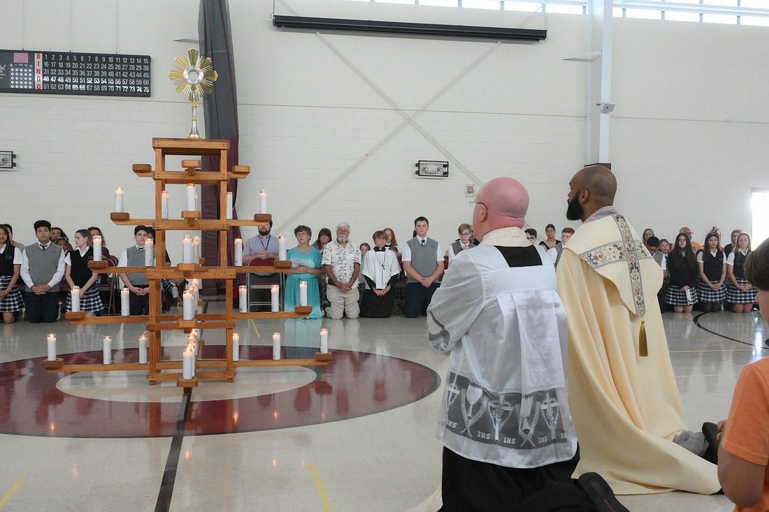 Students in St. Mary Academy, Manahawkin, attend Adoration of the Blessed Sacrament with their teachers, families and other visitors during the second day of the Seton route pilgrimage visit to the Diocese on May 29. Mike Ehrmann photo