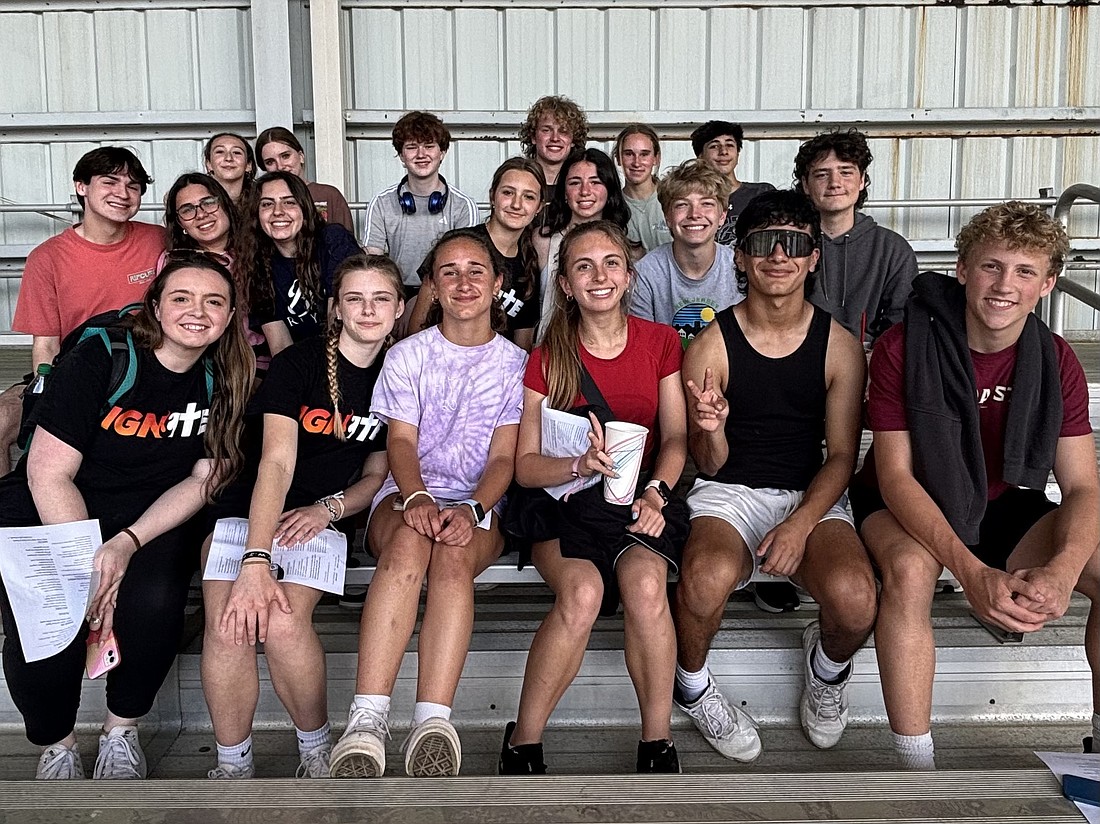 Youth from St. James Parish, Pennington, St. Alphonsus Parrish in Hopewell, St. George Parish in Titusville, gather for a group photo before Mass in the Batman Stunt Arena on Pentecost Sunday. Courtesy photo.