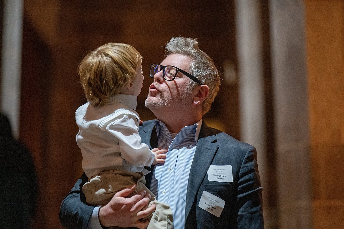 Matthew Morris and son Teller share a father-son moment at the Cathedral of Mary Our Queen in Baltimore Jan. 20, 2024. (OSV News photo/Kevin J. Parks, Catholic Review)