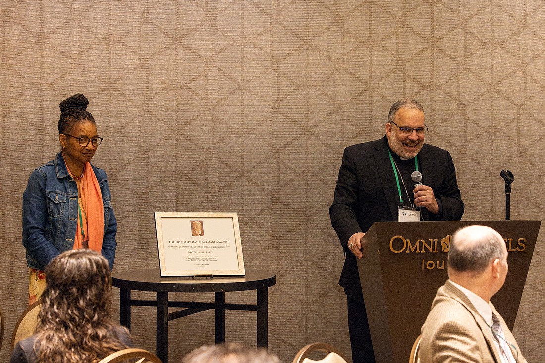 Bishop John E. Stowe of Lexington, Ky., accepts the inaugural Dorothy Day Peacemaker Award on behalf of Pax Christi USA June 11, 2024, at a breakfast in Louisville, Ky., before the annual spring meeting of the U.S. Conference of Catholic Bishops June 12-14. Pictured to the left of Bishop Stowe, bishop president of Pax Christi's national council, is Charlene Howard, the organization’s national council chair. The award was given by the Dorothy Day Guild, which supports and advances Day's sainthood cause. (OSV News photo/courtesy of the Dorothy Day Guild)