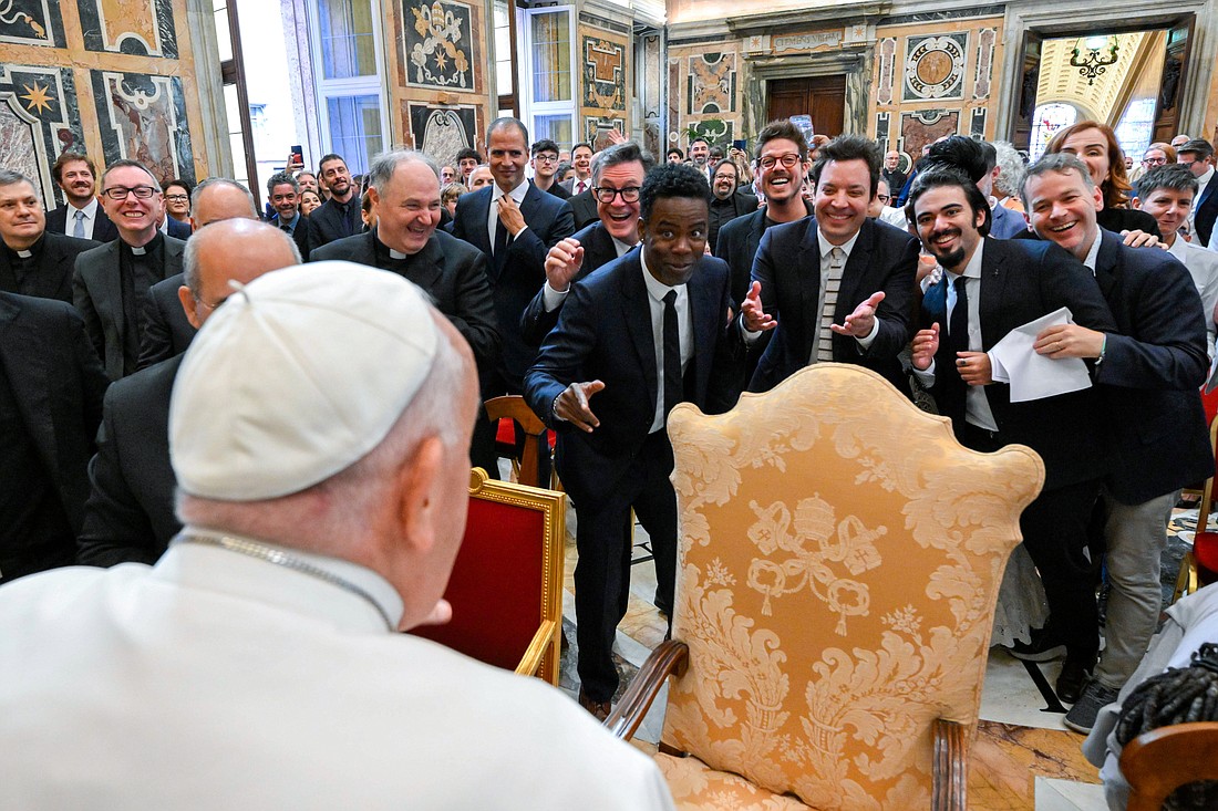 Pope Francis engages in a light-hearted moment with comedians Stephen Colbert, Chris Rock, Jimmy Fallon and other comedians after an audience at the Vatican June 14, 2024. (CNS photo/Vatican Media)