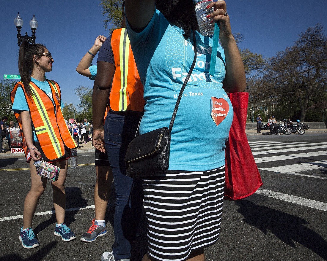 A pregnant woman is seen outside the U.S. Supreme Court in Washington in this 2016 file photo. A federal court in Louisiana June 17, 2024, issued a temporary injunction blocking the Equal Employment Opportunity Commission from enforcing an abortion provision in regulations meant to add workplace protections for pregnant workers against Catholic ministries who challenged them. The ruling comes in lawsuit filed May 22 by the U.S. Conference of Catholic Bishops, and other Catholic groups. (OSV News photo/Tyler Orsburn, CNS)