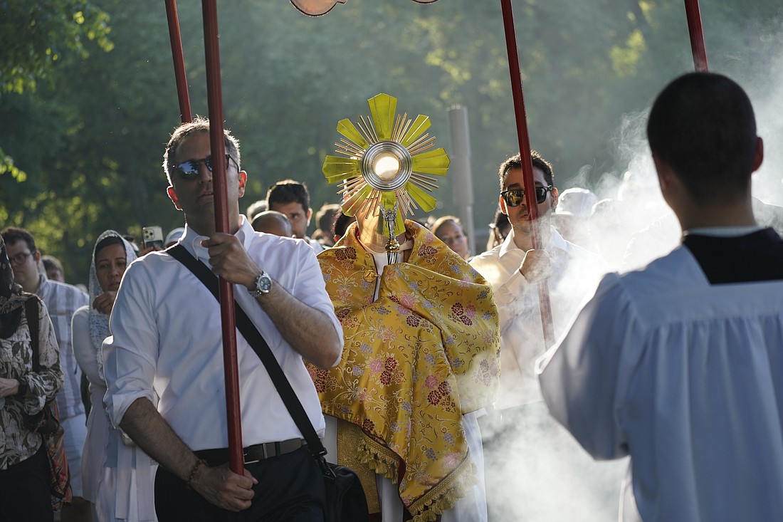 Dominican Father Peter Martyr Yungwirth carries the monstrance as pilgrims journeying through the Archdiocese of New York on the National Eucharistic Pilgrimage's Seton (East) Route process through Central Park in New York City May 25, 2024. (OSV News photo/Gregory A. Shemitz)