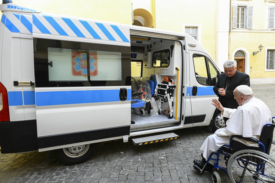 Pope Francis, alongside Papal Almoner Cardinal Konrad Krajewski, blesses an ambulance to be donated to a hospital in Ukraine's Ternopil region in this undated photo taken at the Vatican and released June 24, 2024. (CNS photo/Dicastery for Charity Services)