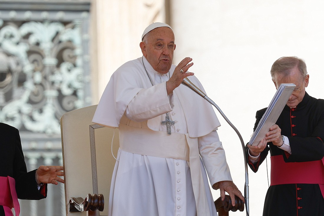Pope Francis gives his blessing to visitors in St. Peter's Square at the end of his weekly general audience at the Vatican June 26, 2024. (CNS photo/Lola Gomez)