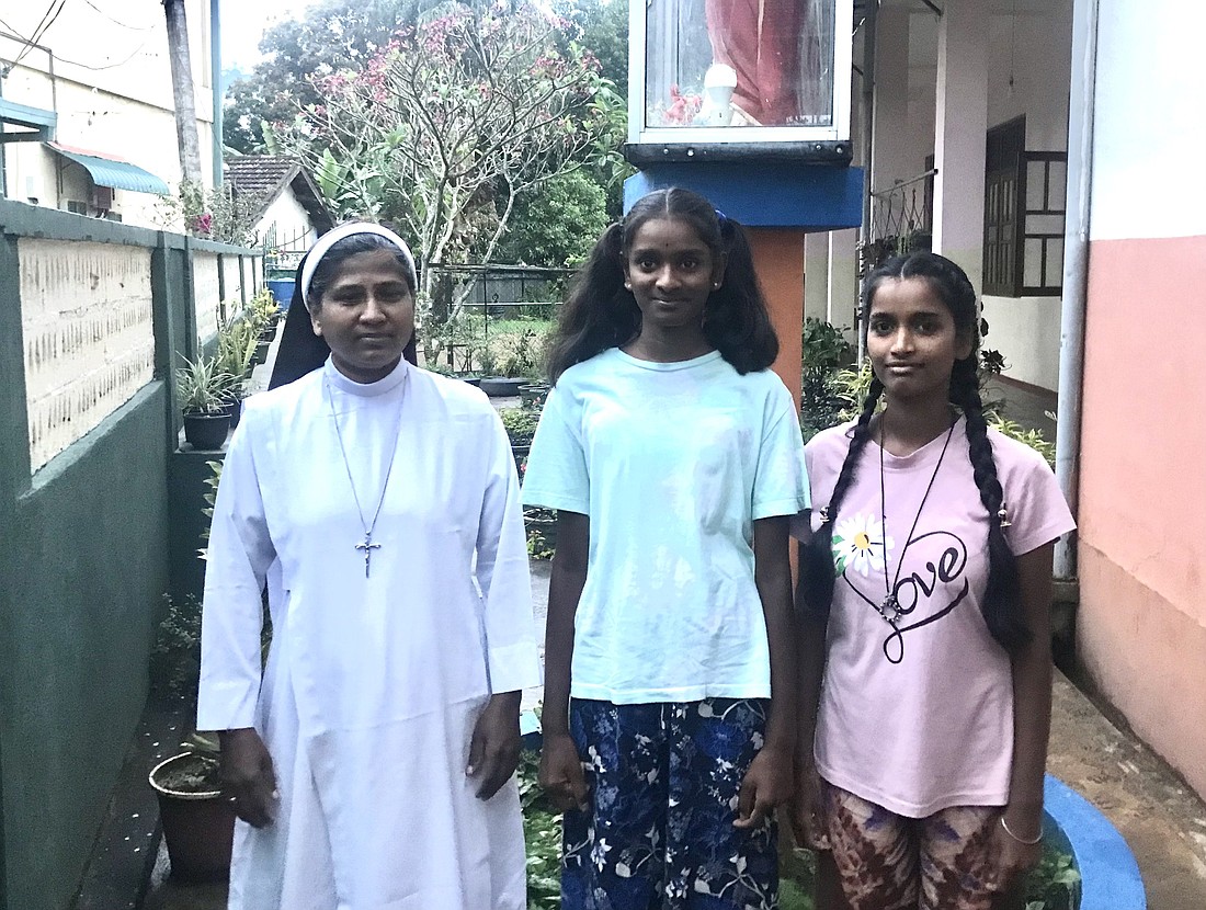 Apostolic Carmel Sister Maria Pramilda, the director of a girl's home for the children of tea plantation workers in Badulla, Sri Lanka, is pictured in an undated photo posing with young women. (OSV News photo/Thomas Scaria, GSR)