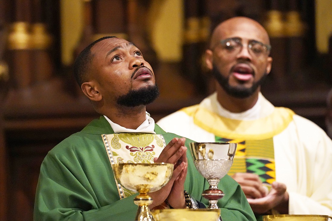 Father Wesbee Victor prays as he concelebrates a Black Catholic History Month Mass at the Basilica of St. Patrick's Old Cathedral in New York City Nov. 18, 2023. (OSV News photo/Gregory A. Shemitz)