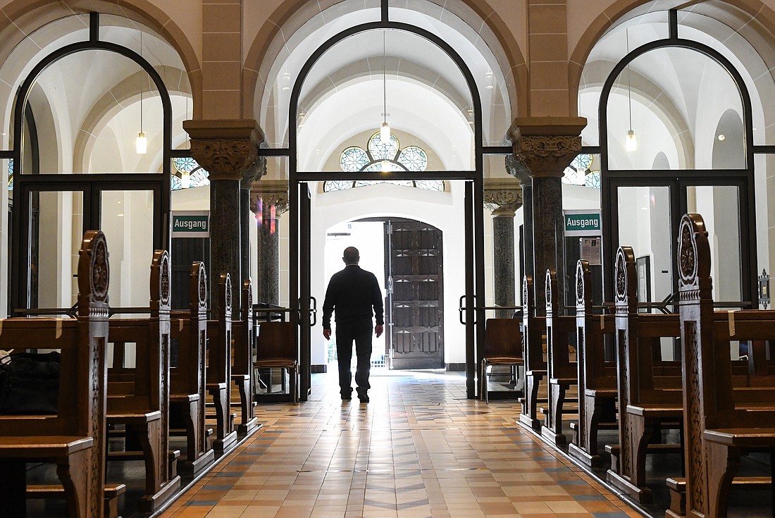 A man leaves an empty church in Bonn, Germany, June 12, 2020. The Catholic Church in Germany continues to shrink, according to a new report released June 27, 2024, by the German bishops' conference. The latest statistics show that more than 400,000 people left the country's Catholic Church last year. (OSV News photo/Harald Oppitz, Reuters)
