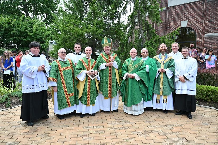 The priests, brothers and novices of the Red Bank Oratory of St. Philip Neri pose for a photo after the Mass with Bishop O'Connell and Oratory of St. Philip Neri officials. From left are, Brother Daniel Bower, C.O.; Brother Donald Ronning, C.O., secretary of the Oratory; Brother James Bonanno, novice; Father Alberto Tamayo, C.O., Oratory provost and pastor of the Oratory Church of St. Anthony of Padua; Bishop O'Connell; Father Marco Guillen, delegate of the Apostolic See; Father Michele Nicolis, C.O., procurator general of the Confederation of the Oratory; Father Nicholas Dolan, C.O., Oratory vicar and parochial vicar of the Oratory Church of St. Anthony of Padua; Brother Zachary Holland, novice, and Brother Anthony Gaudino, novice. MIke Ehrmann photo