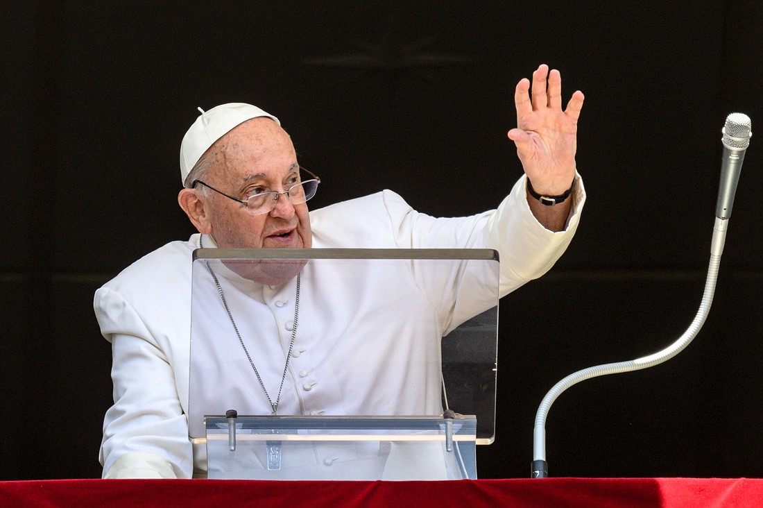 Pope Francis waves to visitors in St. Peter’s Square gathered to pray the Angelus at the Vatican July 14, 2024. (CNS photo/Vatican Media)