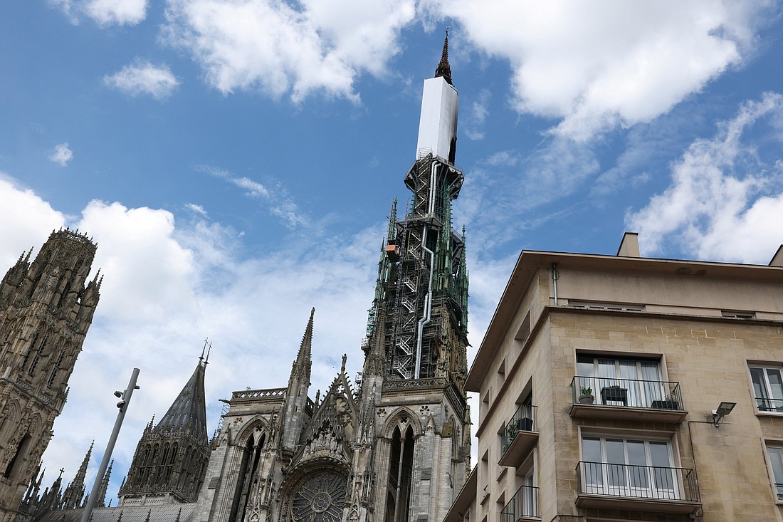 The spire of the Rouen Cathedral in France's Normandy region  is pictured July 11, 2024, after it caught fire during renovation work. About 70 firefighters brought the blaze under control in less than two hours. (OSV News photo/Kevin Coombs, Reuters)