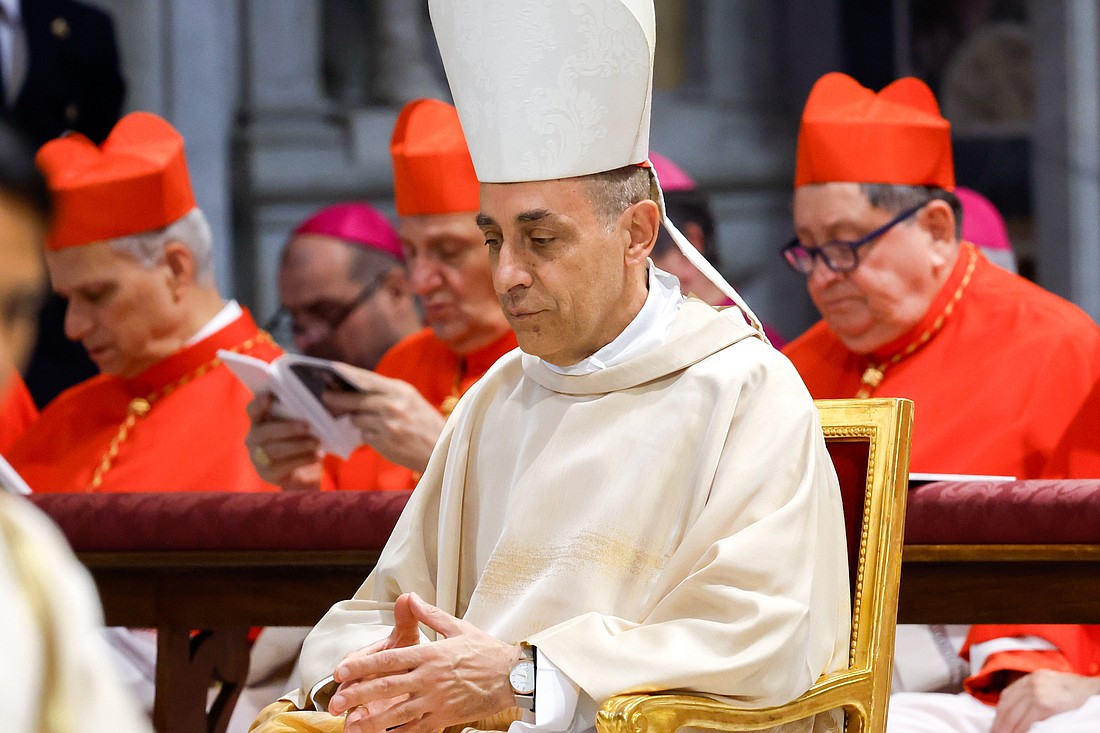 Cardinal Víctor Manuel Fernández, prefect of the Dicastery for the Doctrine of the Faith, prays during Mass with Pope Francis on the feast of the Body and Blood of Christ in Rome's Basilica of St. John Lateran June 2, 2024. (CNS photo/Lola Gomez)