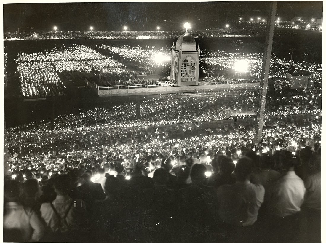 A candlelit crowd is seen at midnight Mass during the 1941 National Eucharistic Congress at the Minnesota State Fairgrounds in St. Paul, Minn. (OSV News photo/Courtesy Archives of the Archdiocese of St. Paul and Minneapolis)