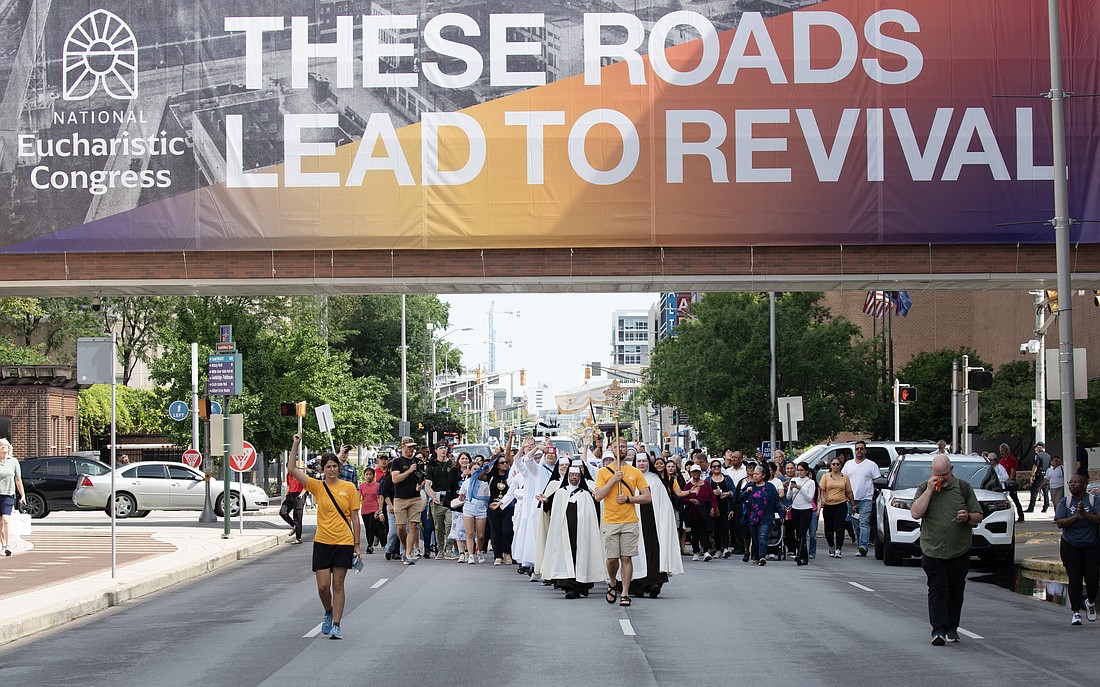 Pilgrims on the final leg of the National Eucharistic Pilgrimage's Seton Route, which launched May 18 in New Haven, Conn., arrive for a welcome Mass at St. John the Evangelist Church in Indianapolis July 16, 2024, just head of the National Eucharistic Congress. (OSV News photo/Bob Roller)