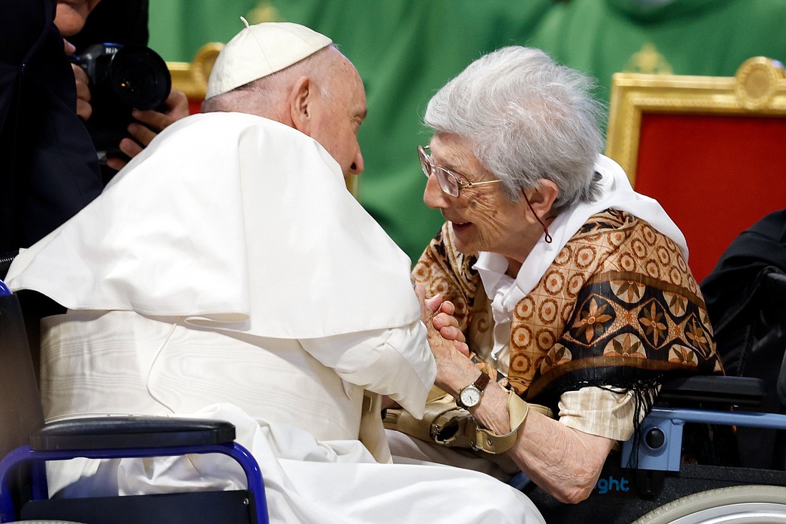 Pope Francis greets 100-year-old Lucilla Macelli before celebrating Mass in St. Peter’s Basilica at the Vatican, marking World Day for Grandparents and the Elderly July 23, 2023. (CNS photo/Lola Gomez)