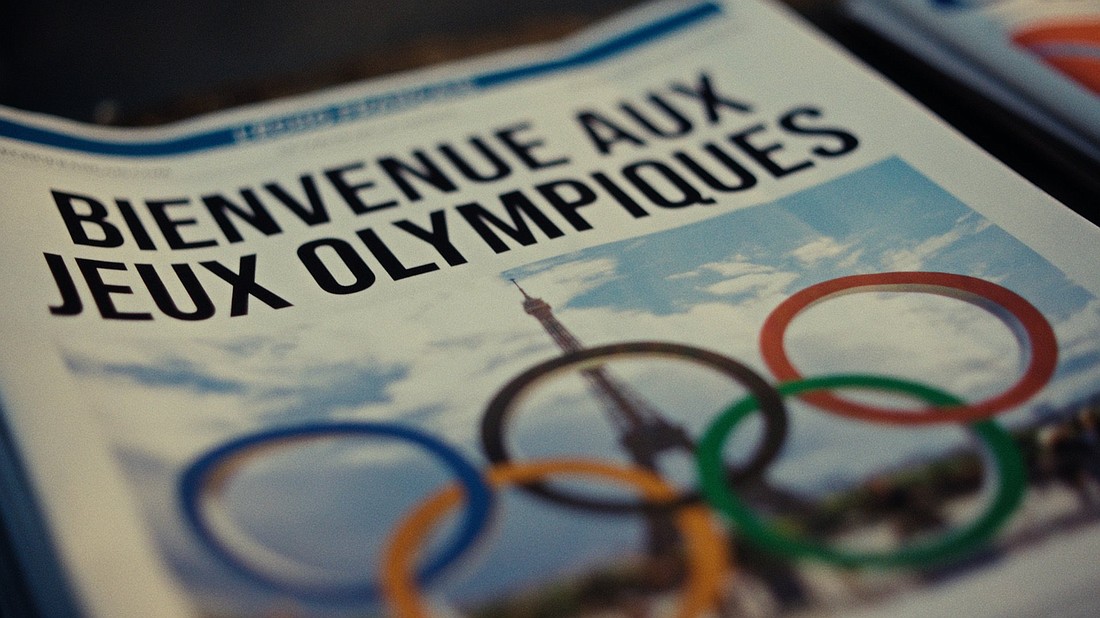 An illustration of the cover of a newspaper features the headline "Bienvenue aux Jeux Olympiques" (Welcome to the Olympic Games) above an image of the Olympic rings and the Eiffel Tower in Paris. (CNS photo/courtesy of IOC Media)