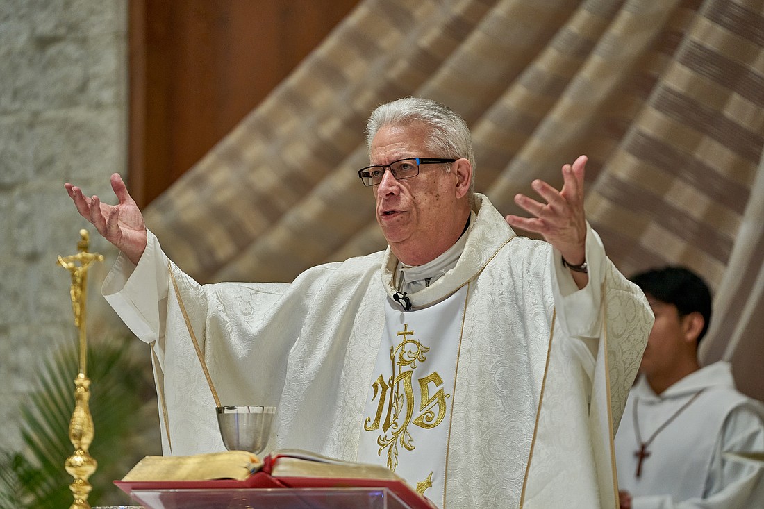 Divine Word Father Pedro Bou celebrates Mass June 2 in Holy Family Church, Lakewood. Vic Mistretta photo