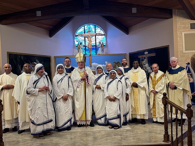 Bishop O’Connell poses for a photo with Missionaries of Charity and priests of the Diocese after the June 6 Mass of Thanksgiving in Holy Innocents Church, Neptune. Staff photo