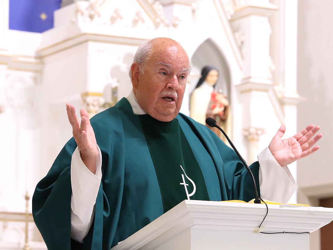 Father Jerome Nolan celebrates Mass June 23 in commemoration of his 
50th anniversary of priesthood. John Batkowski photo