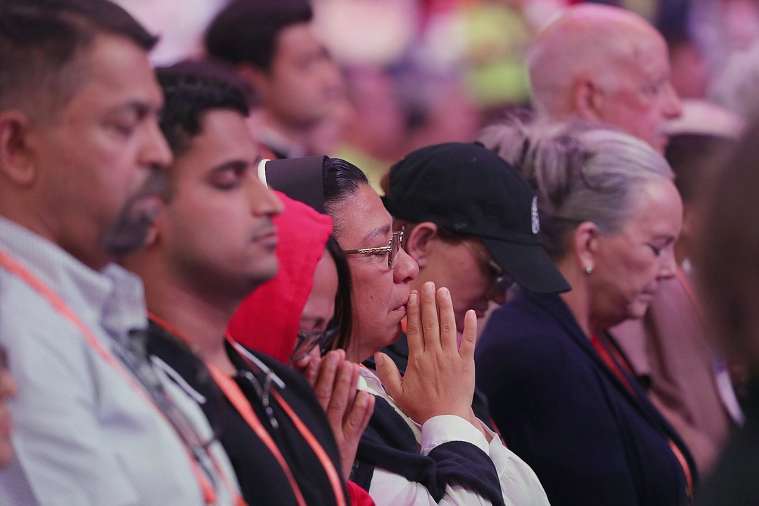 Pilgrims pray during a July 19, 2024, Encounter impact session at Lucas Oil Stadium during the National Eucharistic Congress in Indianapolis. (OSV News photo/Bob Roller)