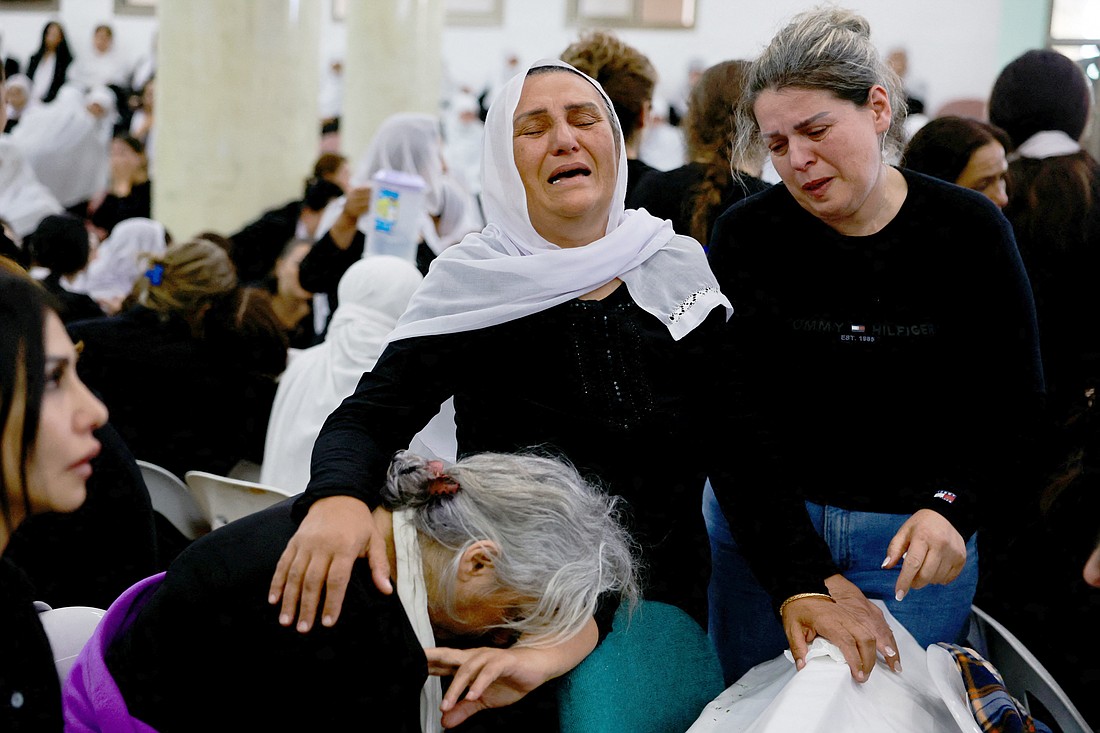 Families whose children were killed at a soccer field by a missile attack mourn before their funeral in Majdal Shams, a Druze village in the Israeli-occupied Golan Heights, July 28 2024.  Israeli authorities said a rocket from Lebanon struck the soccer field, killing 12 children and teens in what the military called the deadliest attack on civilians since Oct. 7, 2023. The Middle East braced for a potential flare-up in violence after the attack. (OSV News photo/Ammar Awad, Reuters)